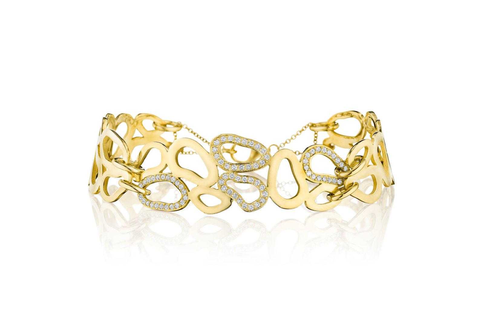Premium Photo | Luxury gold diamond hand bracelet black background
